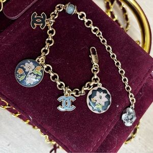 Gold-Tone Bracelet with Black and Light Blue Enamel Floral Charms